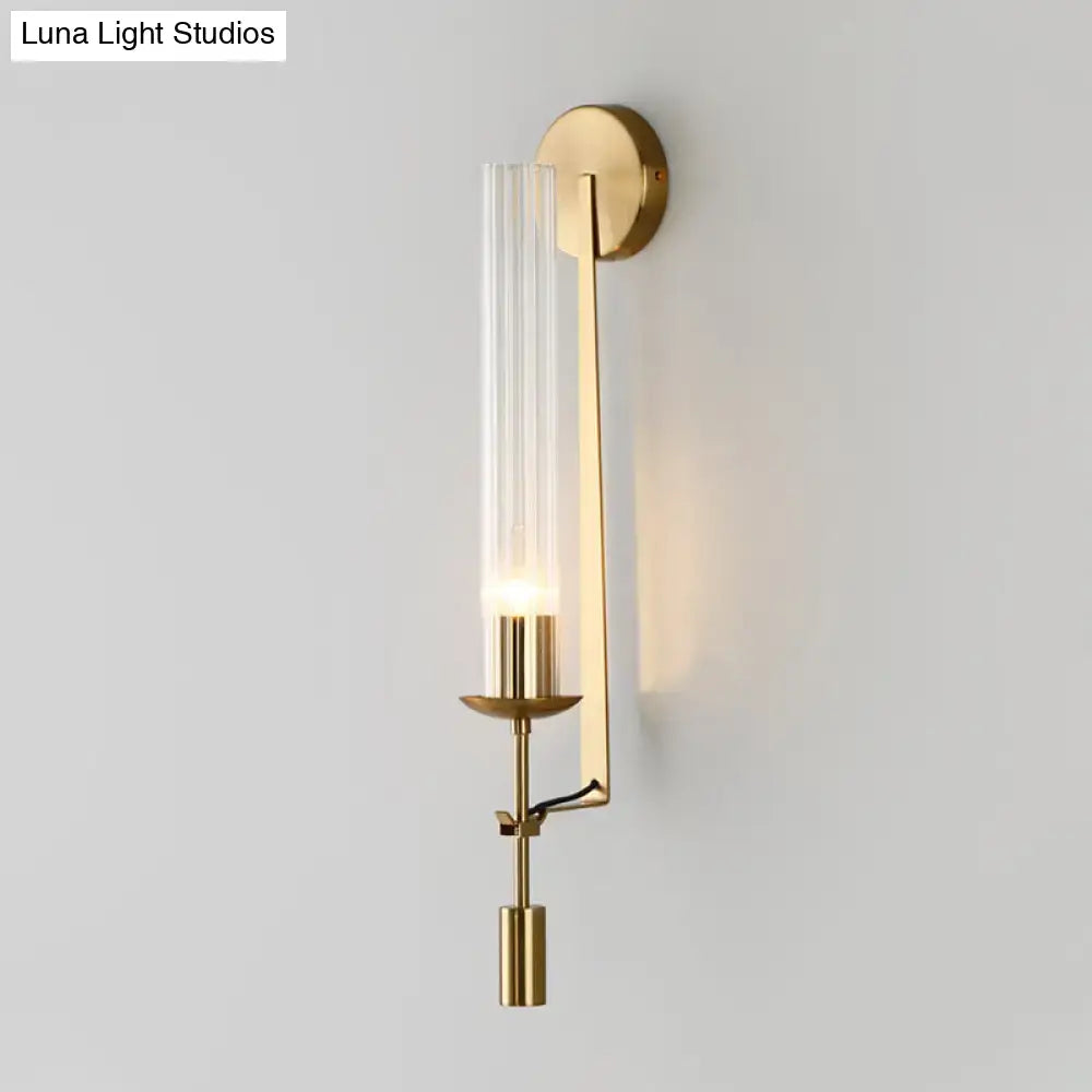 Gold glass bathroom sconce with clear ribbed glass tube and brass finish by Decorbites on Tampa Home & Garden Store