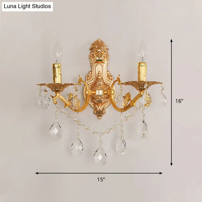 Gold crystal candelabra sconce by Decorbites, two-arm wall lamp with hanging prisms on Tampa Home & Garden Store