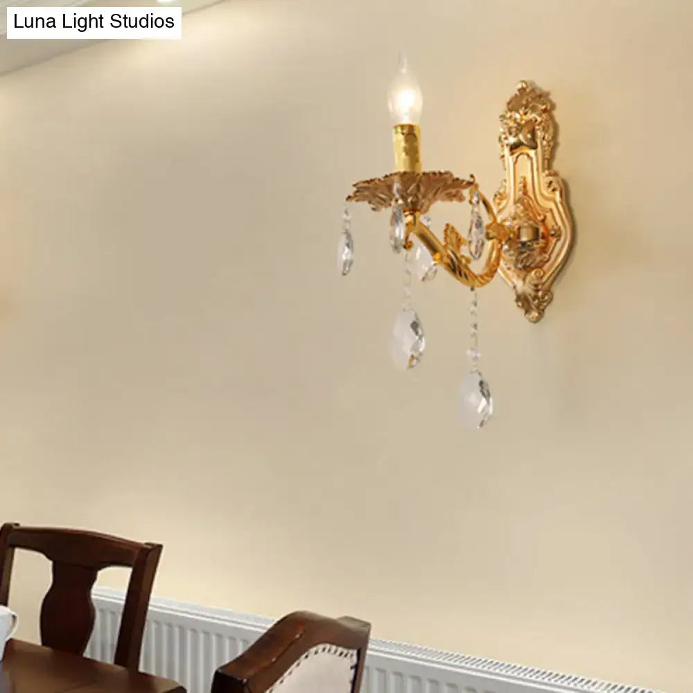Gold crystal candelabra wall sconce with hanging prisms and ornate backplate Decorbites on Tampa Home & Garden Store