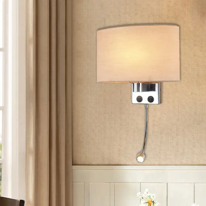 Gold fabric shade wall sconce in champagne-chrome finish with square backplate and pull chain on Tampa Home & Garden Store