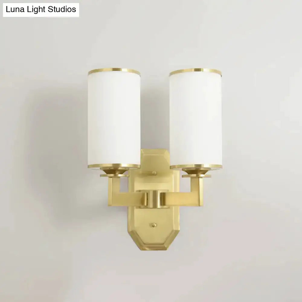 Modern gold wall sconce with dual opal glass shades for bedroom lighting on Tampa Home & Garden Store