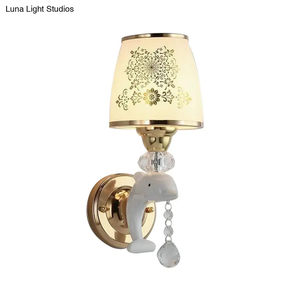 Gold dolphin wall sconce with ivory floral-pattern lampshade, crystal bead accents on Tampa Home & Garden Store
