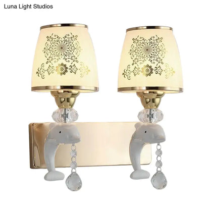 Gold Dolphin Wall Sconce with twin beige shades, crystal drops, pair of dolphin backplates on Tampa Home & Garden Store