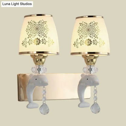 Decorbites Gold Dolphin Wall Sconce with dual lights, cream floral shades, gold finish on Tampa Home & Garden Store