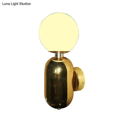 Gold Glass Globe Sconce by Decorbites; brass wall-mount light on Tampa Home & Garden Store