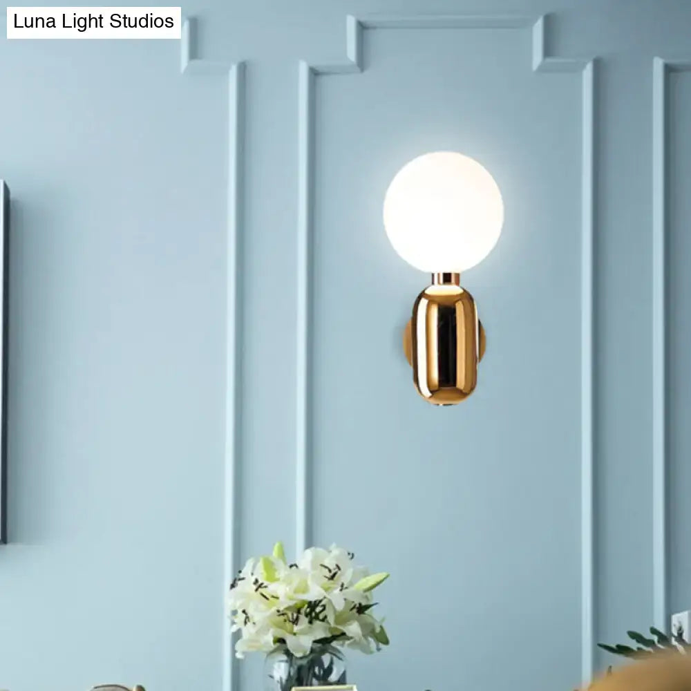 Gold Glass Globe Sconce by Decorbites, gold metallic wall light with white glass globe on Tampa Home & Garden Store