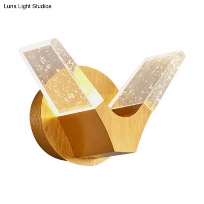 Gold Wings Wall Light by Decorbites with circular base and two clear crystal wing prisms on Tampa Home & Garden Store