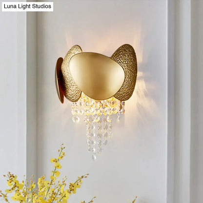 Gold Egg Crystal Wall Sconce with textured side plates and dangling crystal drops, wall-mounted on Tampa Home & Garden Store