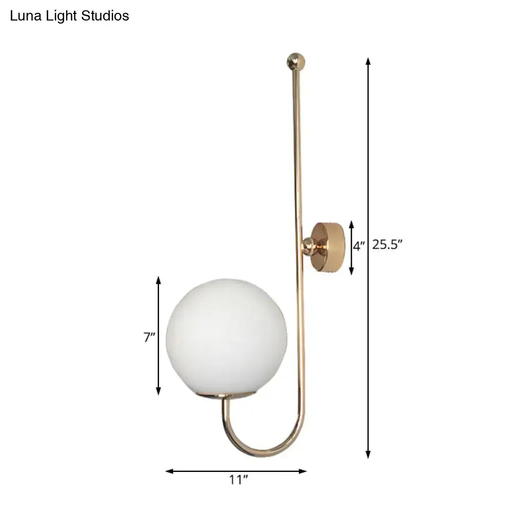 Gold gooseneck wall sconce by Decorbites with white glass globe shade and curved arm on Tampa Home & Garden Store