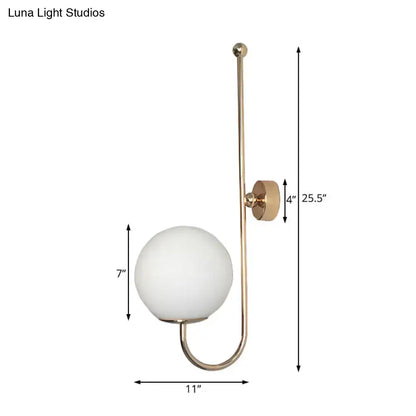 Gold gooseneck wall sconce by Decorbites with white glass globe shade and curved arm on Tampa Home & Garden Store