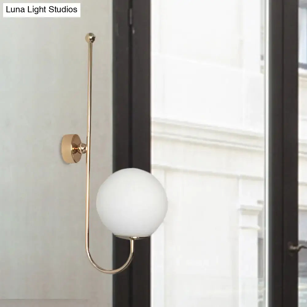 Gold gooseneck wall sconce by Decorbites with frosted glass globe shade on Tampa Home & Garden Store