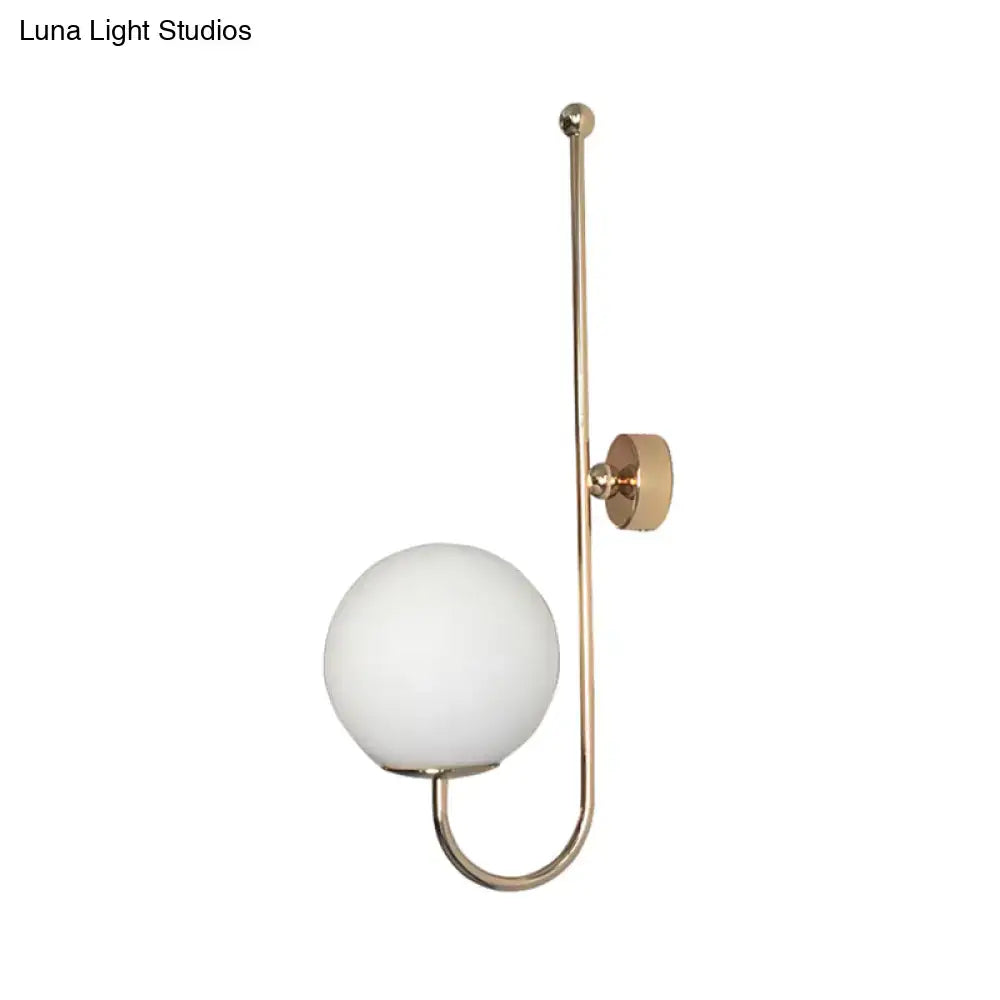 Gold gooseneck wall sconce by Decorbites with white glass globe on Tampa Home & Garden Store