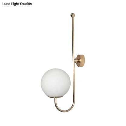 Gold gooseneck wall sconce by Decorbites with white glass globe on Tampa Home & Garden Store