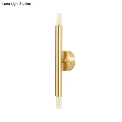 Gold tubular wall sconce by Decorbites with vertical cylindrical body and round wall mount on Tampa Home & Garden Store