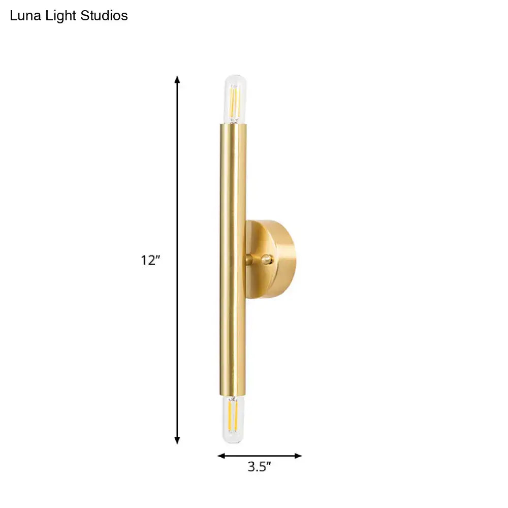 Gold tubular wall sconce Decorbites with brass finish on round backplate on Tampa Home & Garden Store