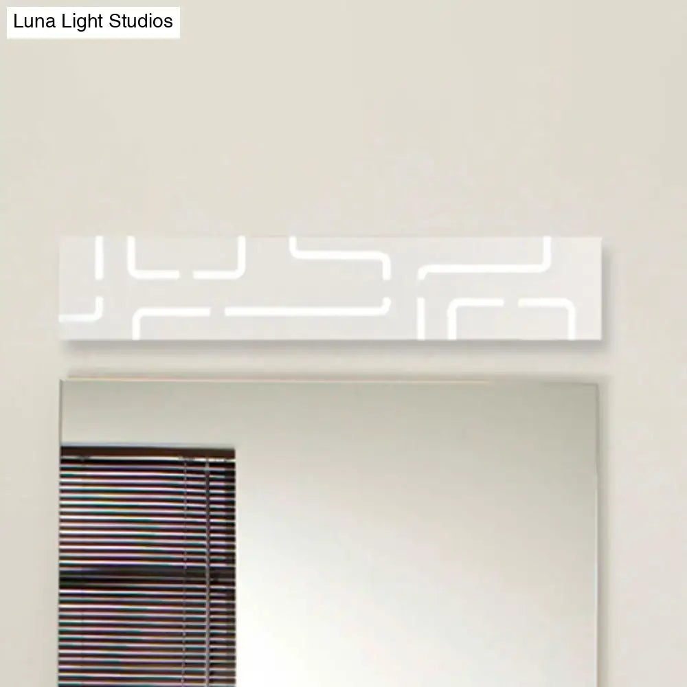 Gray Geometric LED Wall Sconce by Decorbites, mounted above a bathroom mirror with blinds on Tampa Home & Garden Store