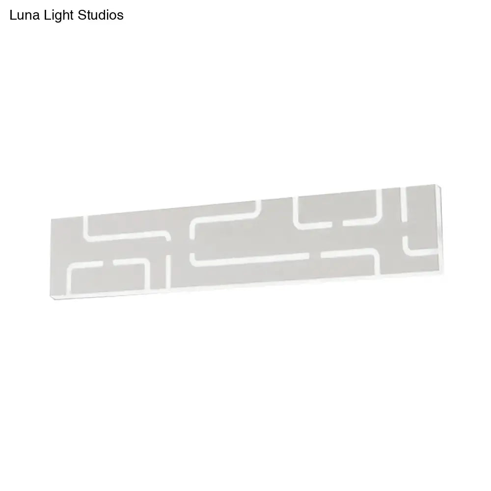 Gray geometric LED wall sconce with white maze-like lines on Tampa Home & Garden Store