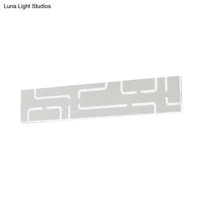 Gray geometric LED wall sconce with white maze-like lines on Tampa Home & Garden Store