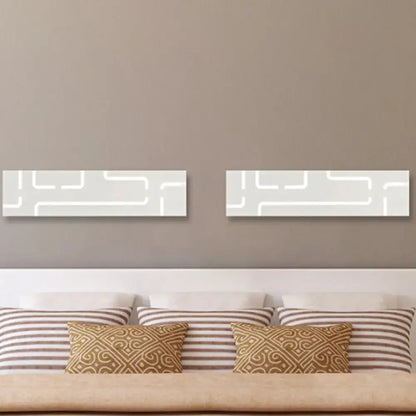 Gray geometric LED wall sconces pair by Decorbites on taupe wall above bed on Tampa Home & Garden Store