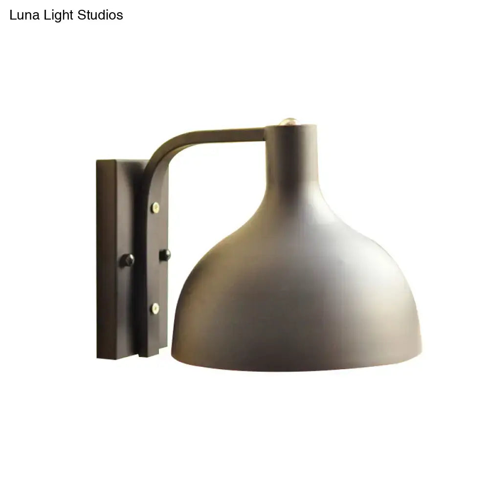 Black domed wall sconce with curved arm and rectangular metal backplate by Decorbites on Tampa Home & Garden Store