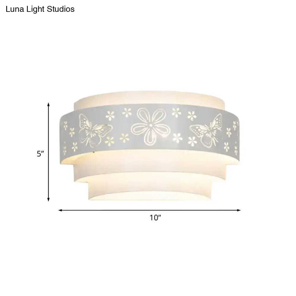 White tiered wall sconce with a gray floral butterfly band and layered white shades 10inW x 5inH on Tampa Home & Garden Store