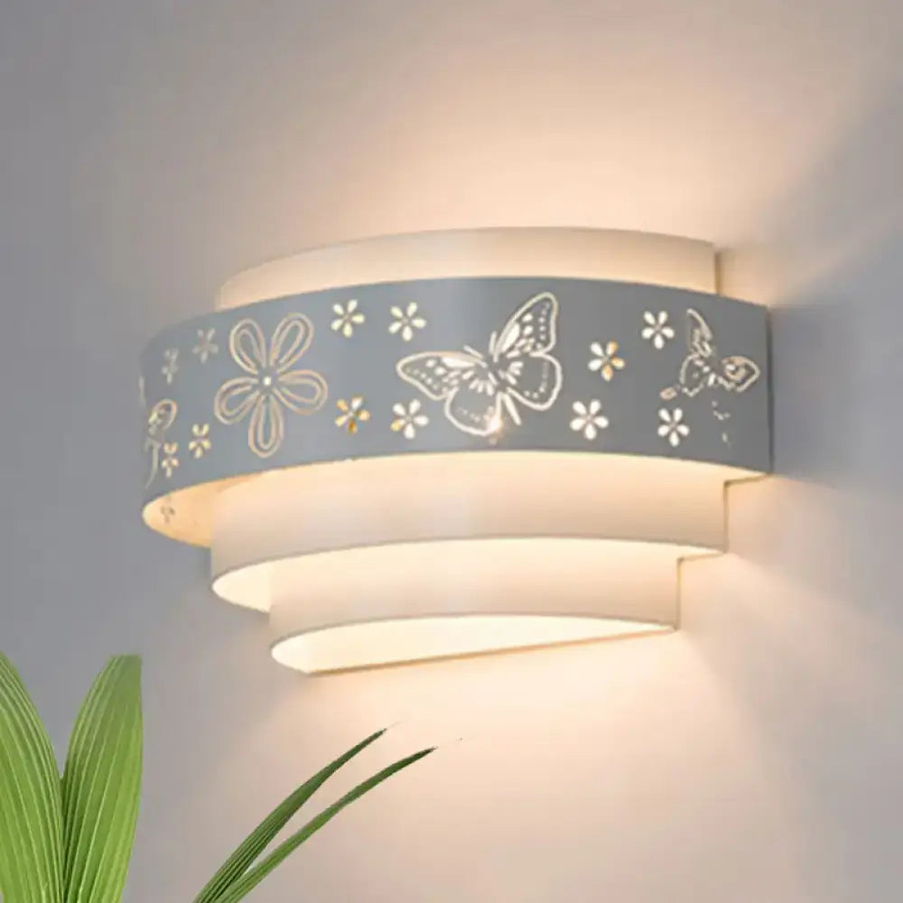 White tiered wall sconce by Decorbites with butterfly and flower motif on a pale band on Tampa Home & Garden Store