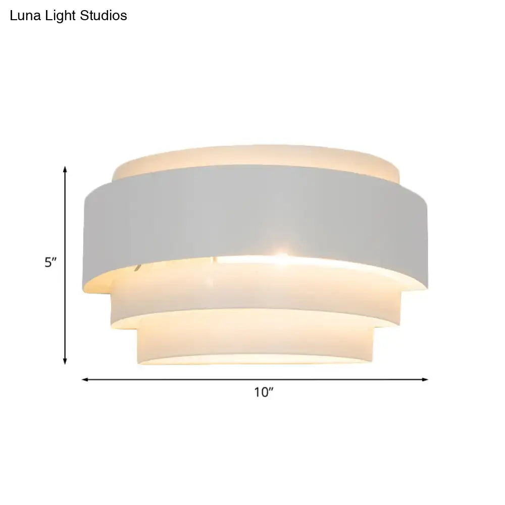 White tiered wall sconce by Decorbites with layered shade on Tampa Home & Garden Store