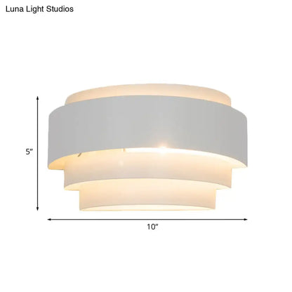 White tiered wall sconce by Decorbites with layered shade on Tampa Home & Garden Store