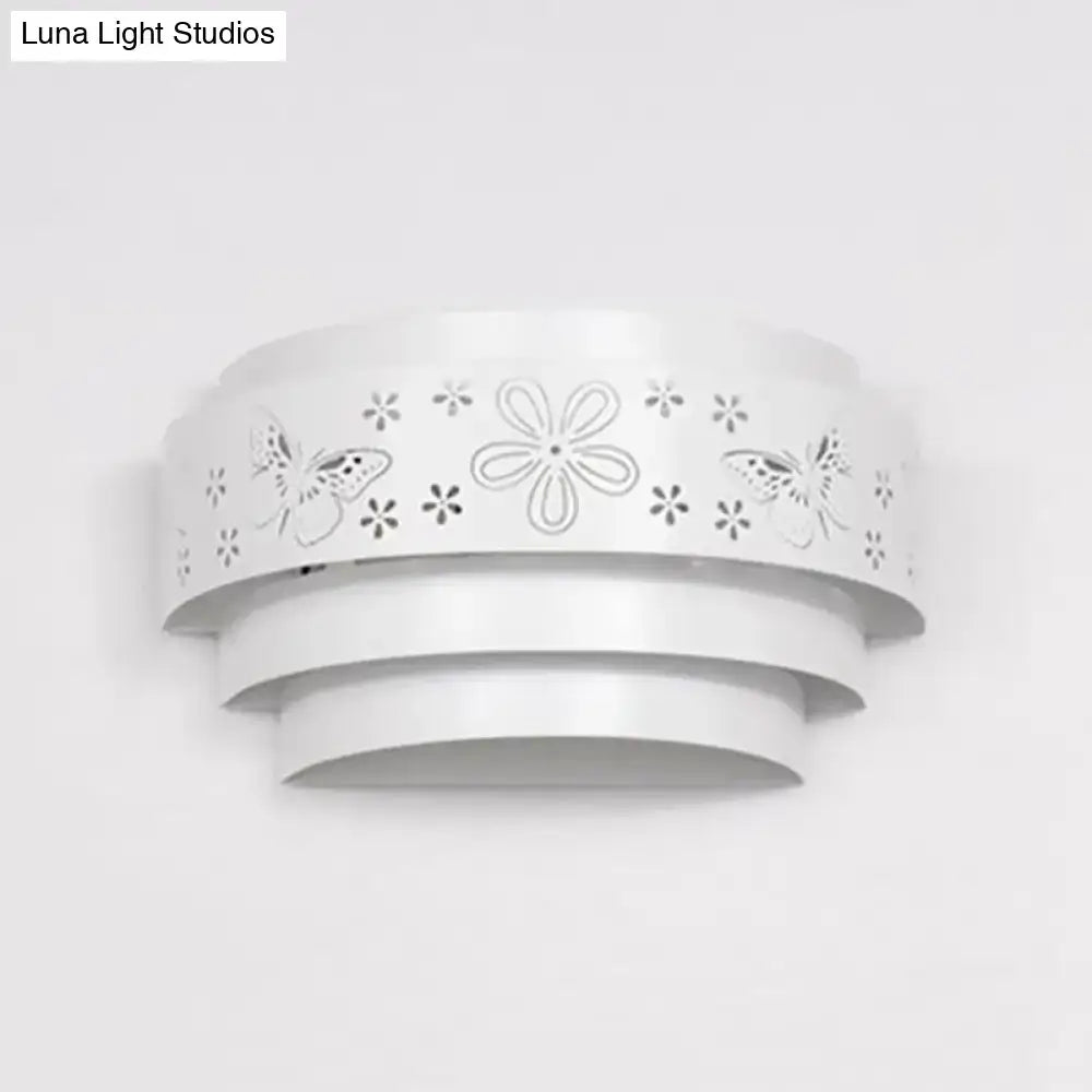 White tiered wall sconce with floral cutout bands by Decorbites on Tampa Home & Garden Store