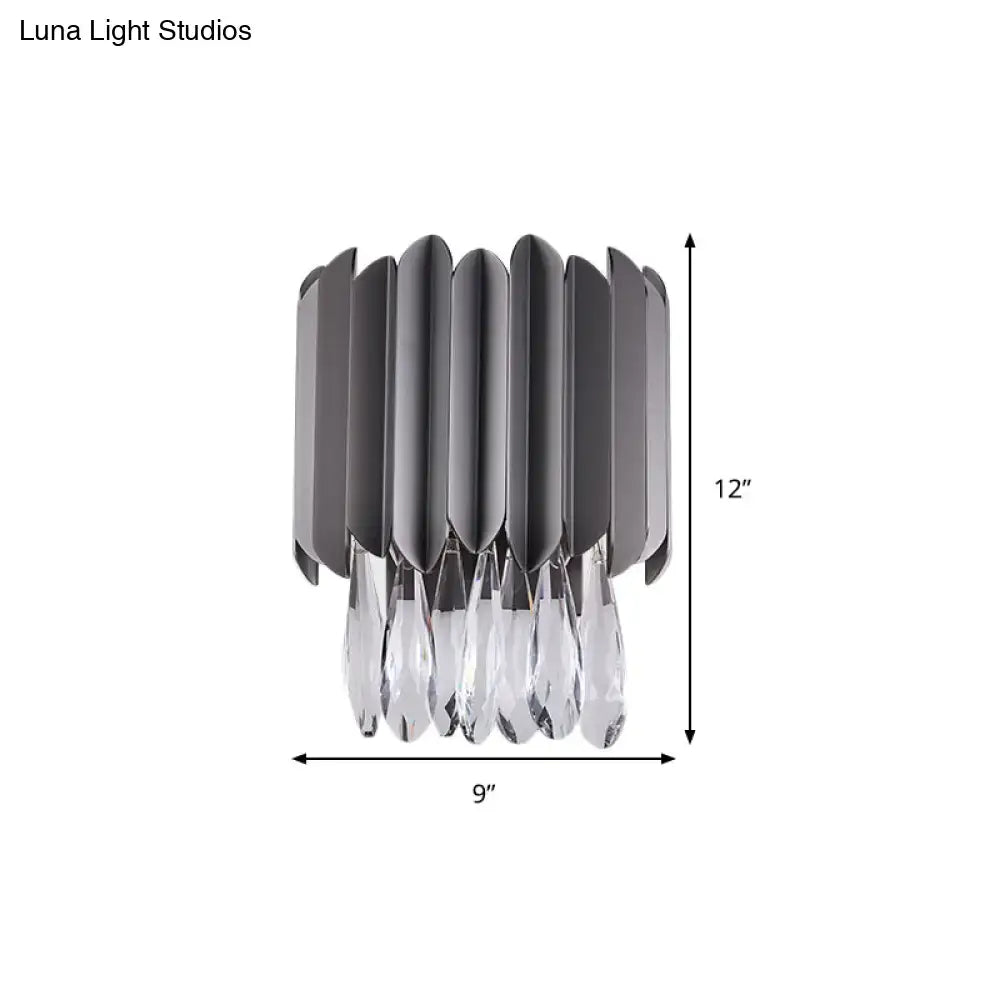Black K9 crystal teardrop dual-light sconce with black metal petals and crystal drops on Tampa Home & Garden Store