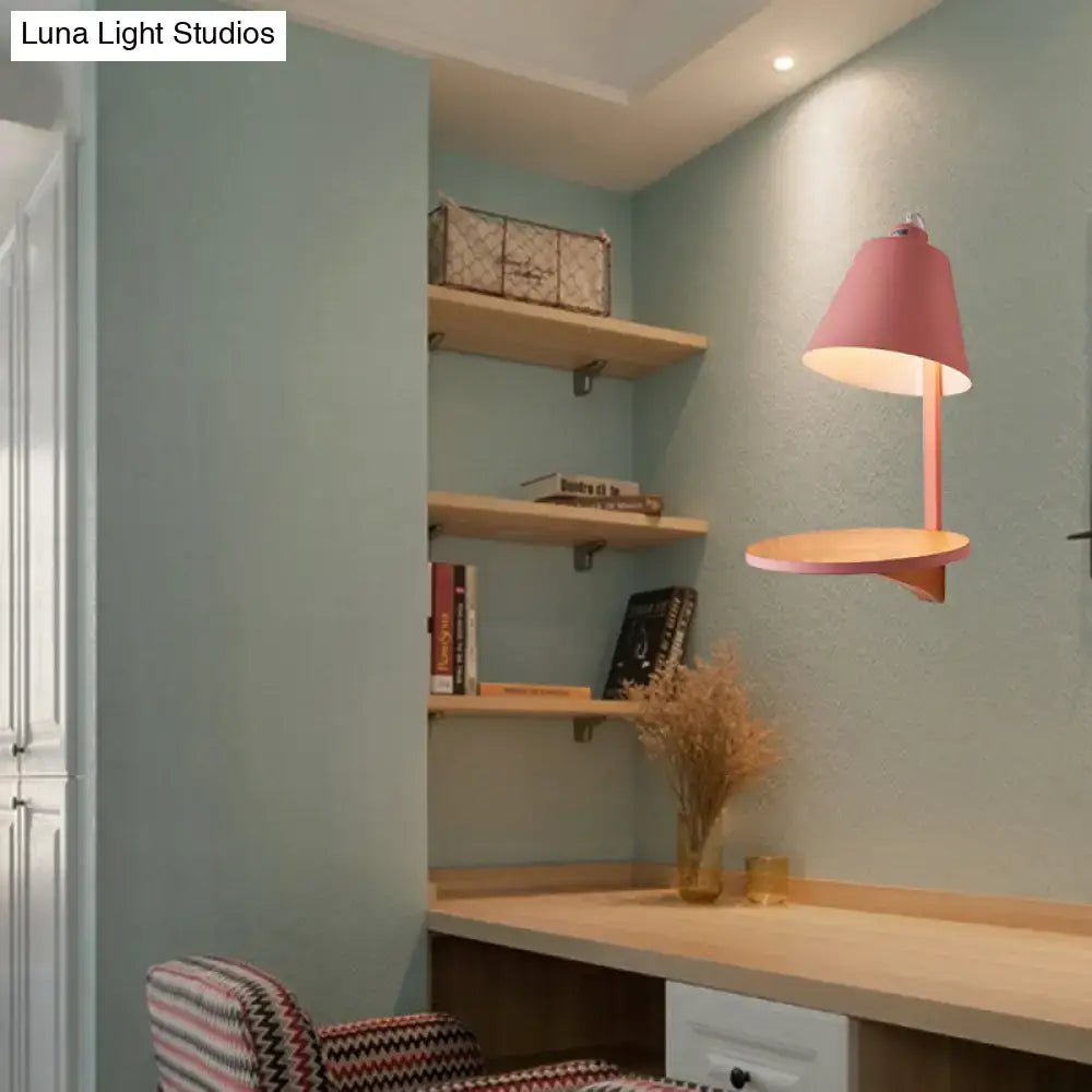Gray tapered shade sconce wall light by Decorbites mounted above a wooden desk in a blue-walled study on Tampa Home & Garden Store