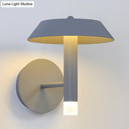 Gray industrial wall sconce with cylindrical stem and frosted bottom light, round mount on Tampa Home & Garden Store