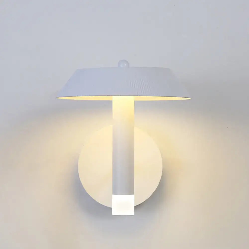 Gray industrial wall sconce with backplate, vertical stem and flat shade, warm downward light on Tampa Home & Garden Store