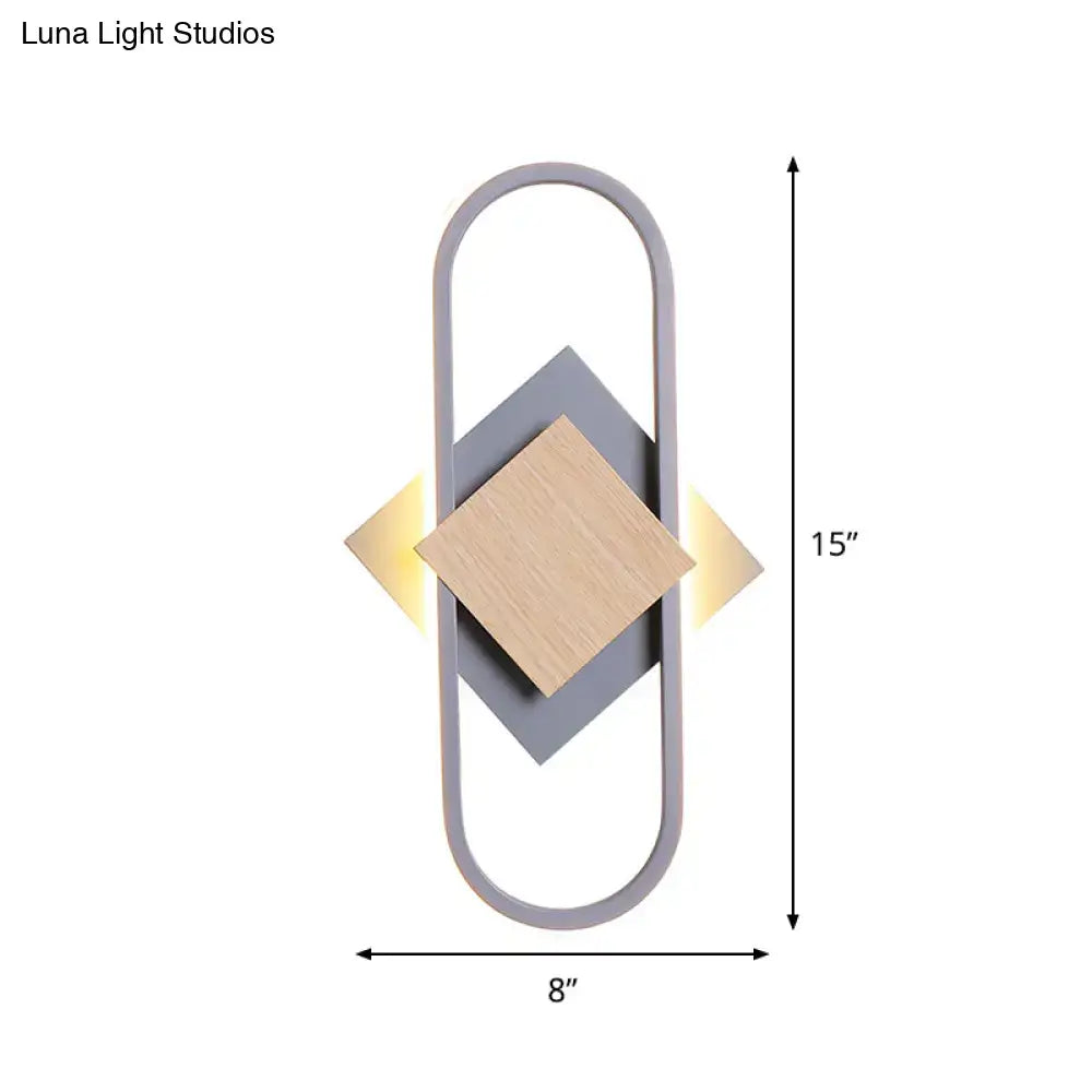 Gray wood geometric sconce with oval frame and wood diamond by Decorbites warm lighting on Tampa Home & Garden Store