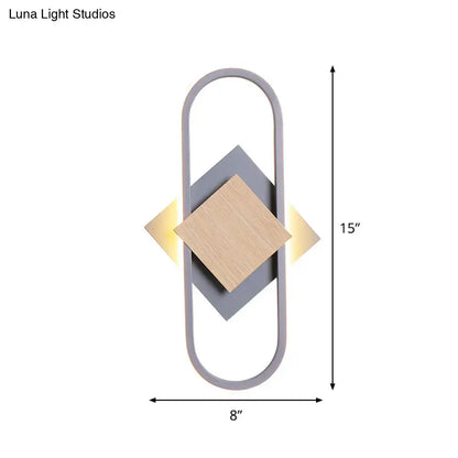 Gray wood geometric sconce with oval frame and wood diamond by Decorbites warm lighting on Tampa Home & Garden Store