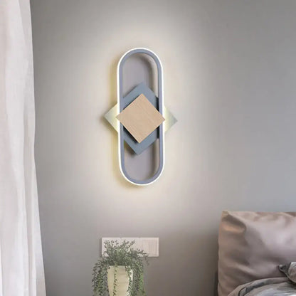 Gray wood geometric sconce by Decorbites, oval wall light with layered diamond centerpiece on Tampa Home & Garden Store