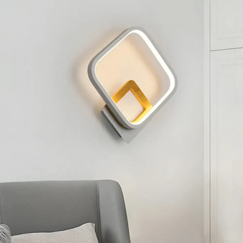 Gray yellow square sconce by Decorbites with gray outer frame and gold inner accent on wall on Tampa Home & Garden Store