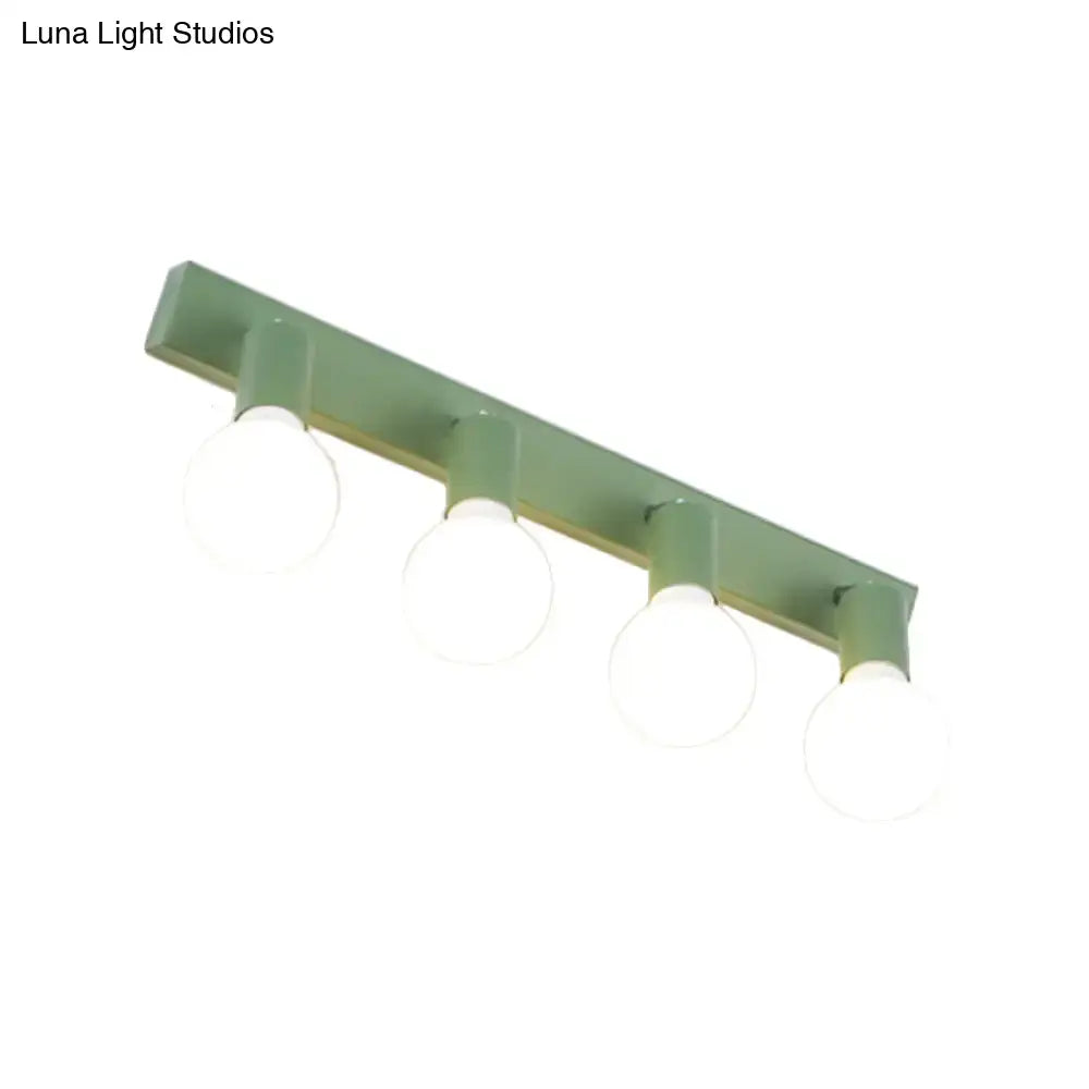 Green four-bulb linear vanity light with round glass globes by Decorbites on Tampa Home & Garden Store