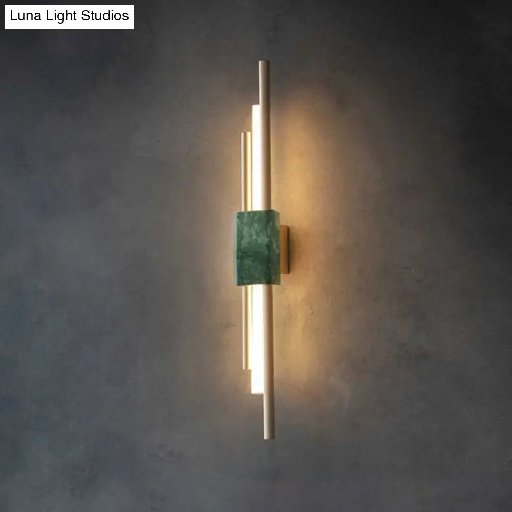 Green marble wall sconce with vertical gold light bars, Luna Light Studios watermark on Tampa Home & Garden Store