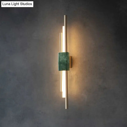 Green marble wall sconce with vertical gold light bars, Luna Light Studios watermark on Tampa Home & Garden Store