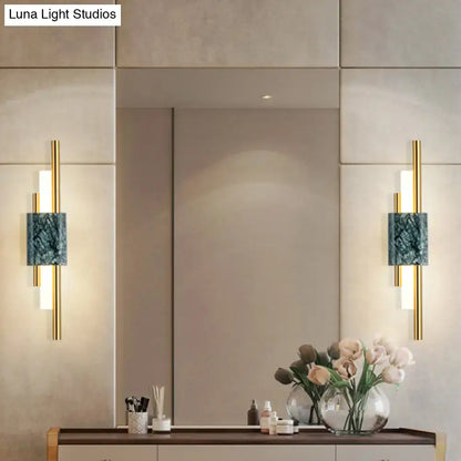 Pair of Green Marble Wall Sconces with gold rods by Decorbites, mounted beside mirror on Tampa Home & Garden Store