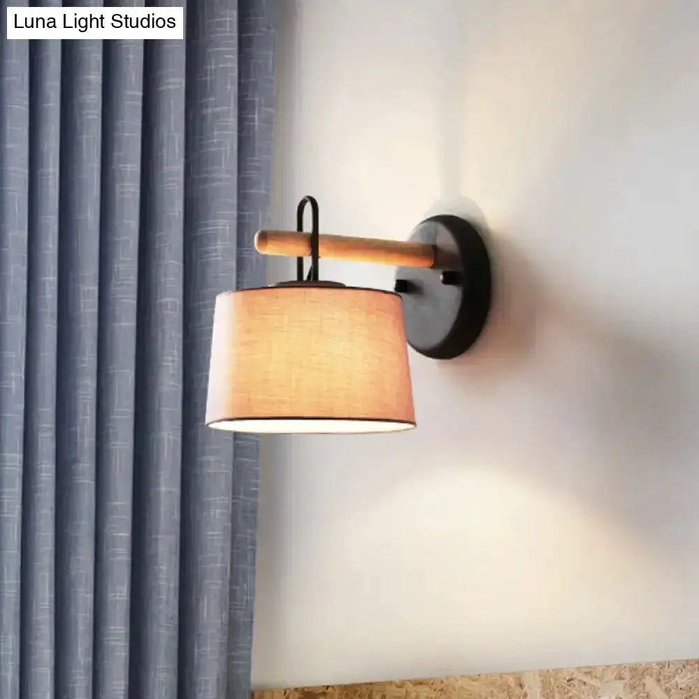 Modern grey drum shade wall lamp with wood arm by Decorbites for bedroom lighting on Tampa Home & Garden Store