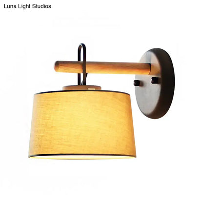 Wall lamp with wood arm and grey drum shade by Decorbites on Tampa Home & Garden Store