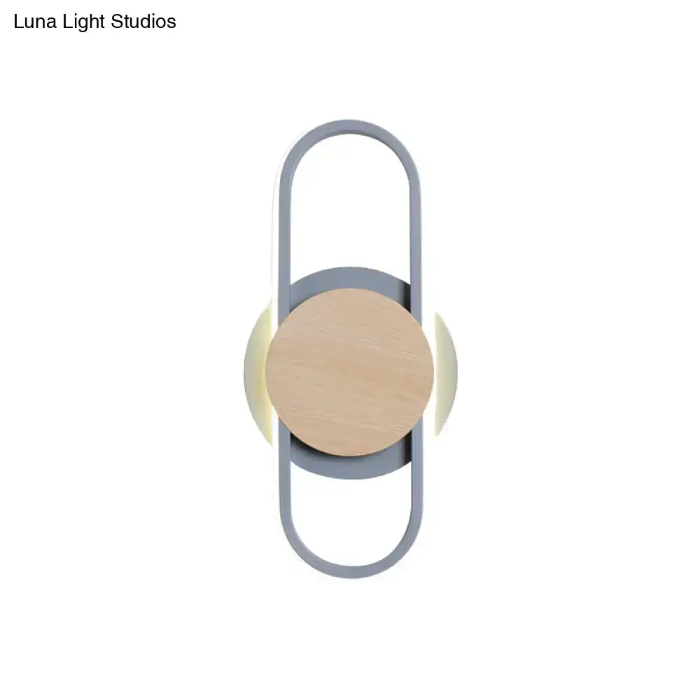 Grey wood LED wall sconce by Decorbites with central natural wood circle in a grey loop frame on Tampa Home & Garden Store