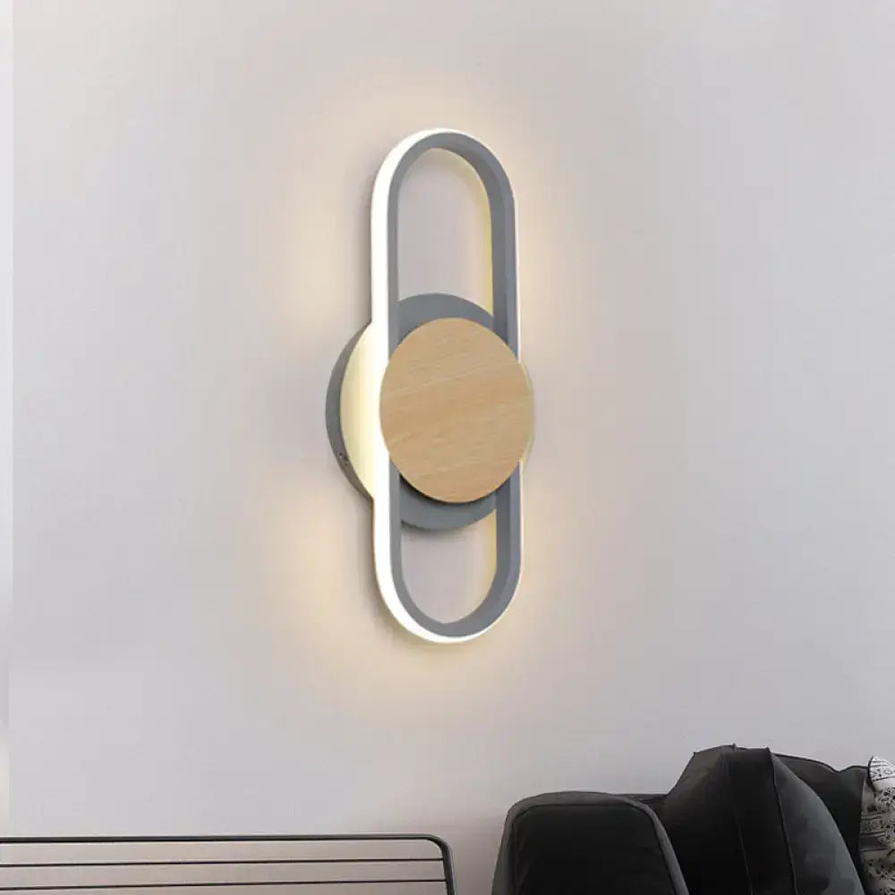 Decorbites grey wood LED wall sconce with round wood disk and illuminated loop frame on Tampa Home & Garden Store