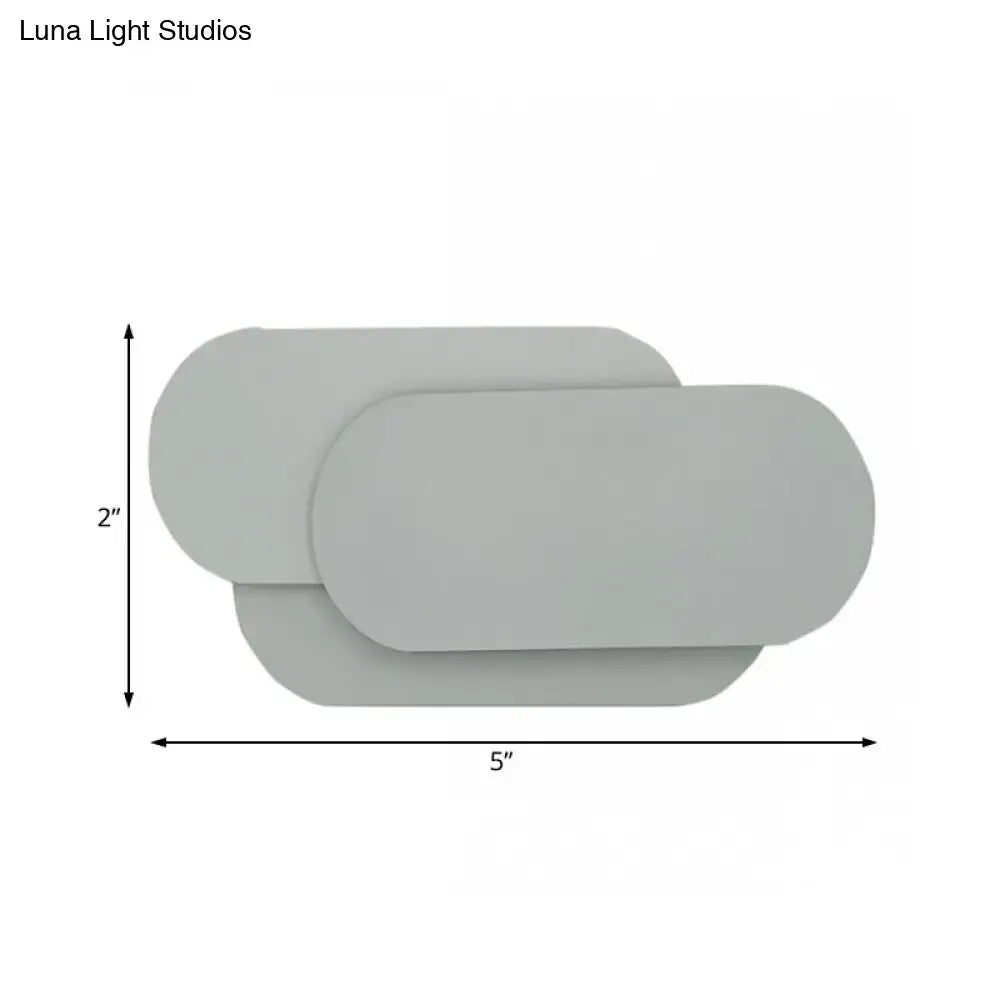 Grey oval metal sconce by Decorbites; slim modern wall light, 5in wide x 2in high on Tampa Home & Garden Store