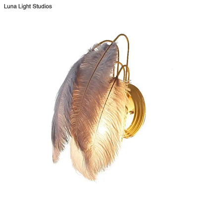 Modern grey and white goose feather wall lamp by Decorbites with gold backplate for bedroom on Tampa Home & Garden Store