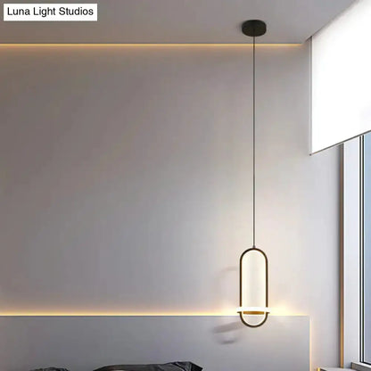 Modern halo ring bedside pendant light by Decorbites with shade on black cord in bedroom on Tampa Home & Garden Store
