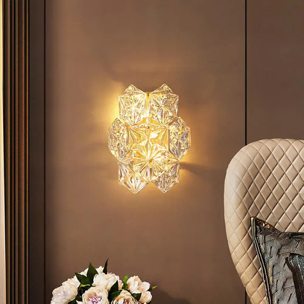Gold hexagon glass postmodern wall sconce by Decorbites emits warm glow on Tampa Home & Garden Store