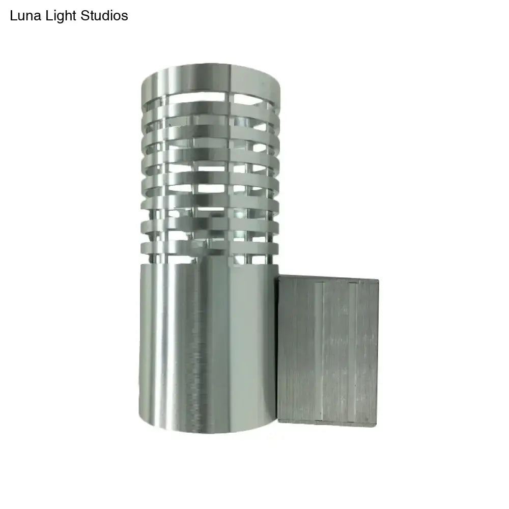 Chrome industrial wall sconce with cylindrical, slatted metal shade and square wall mount on Tampa Home & Garden Store